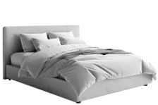 Ein Bett mit Bettwäsche darauf